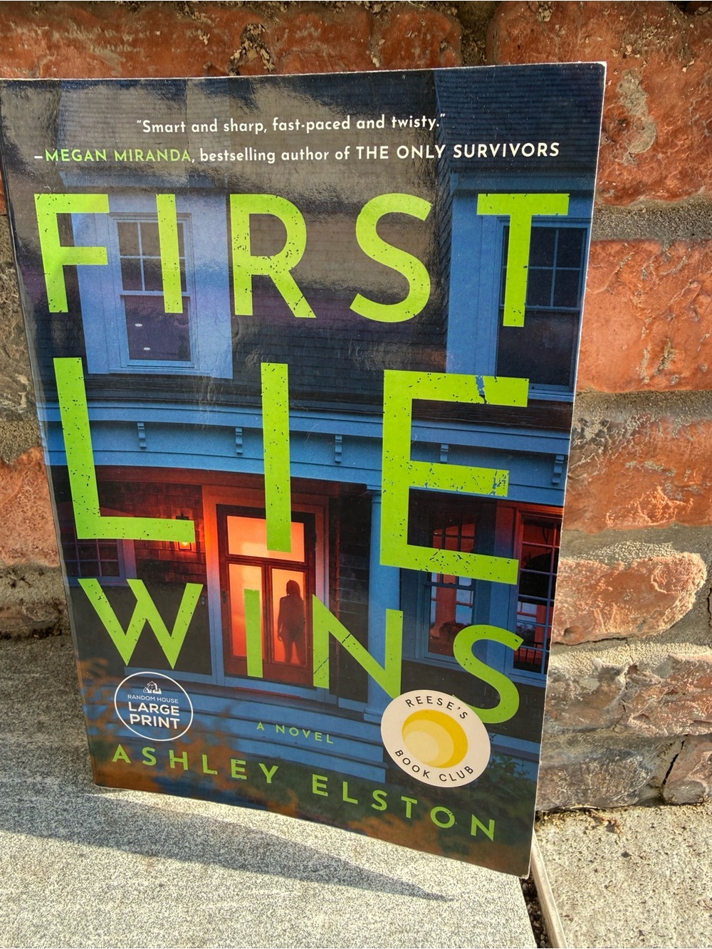 First Lie Wins by Ashley Elston - Neon Green & Navy paperback (Large Print)